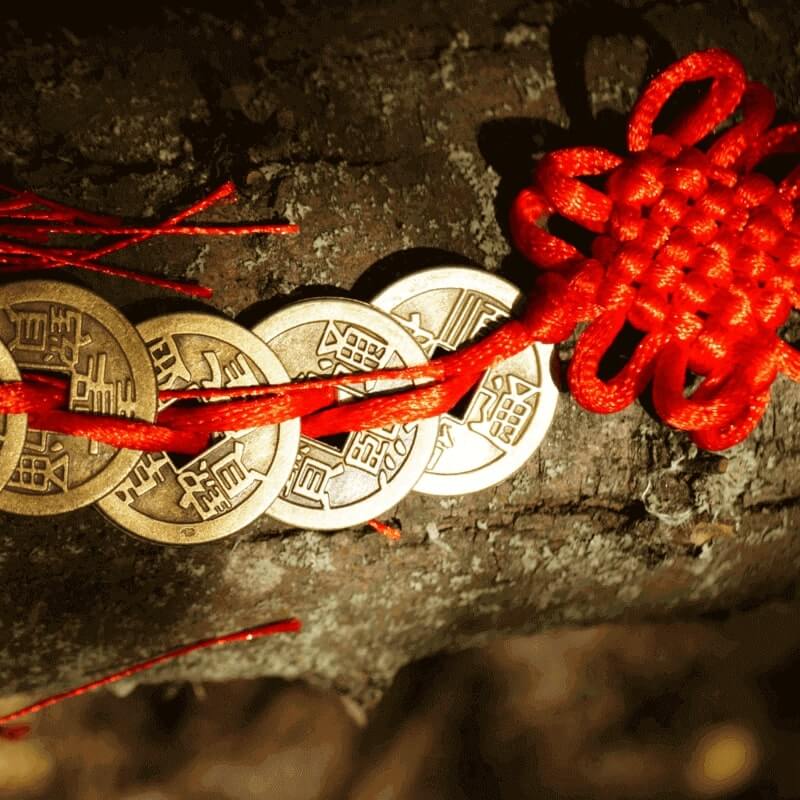 Coins on a string, talisman for good luck